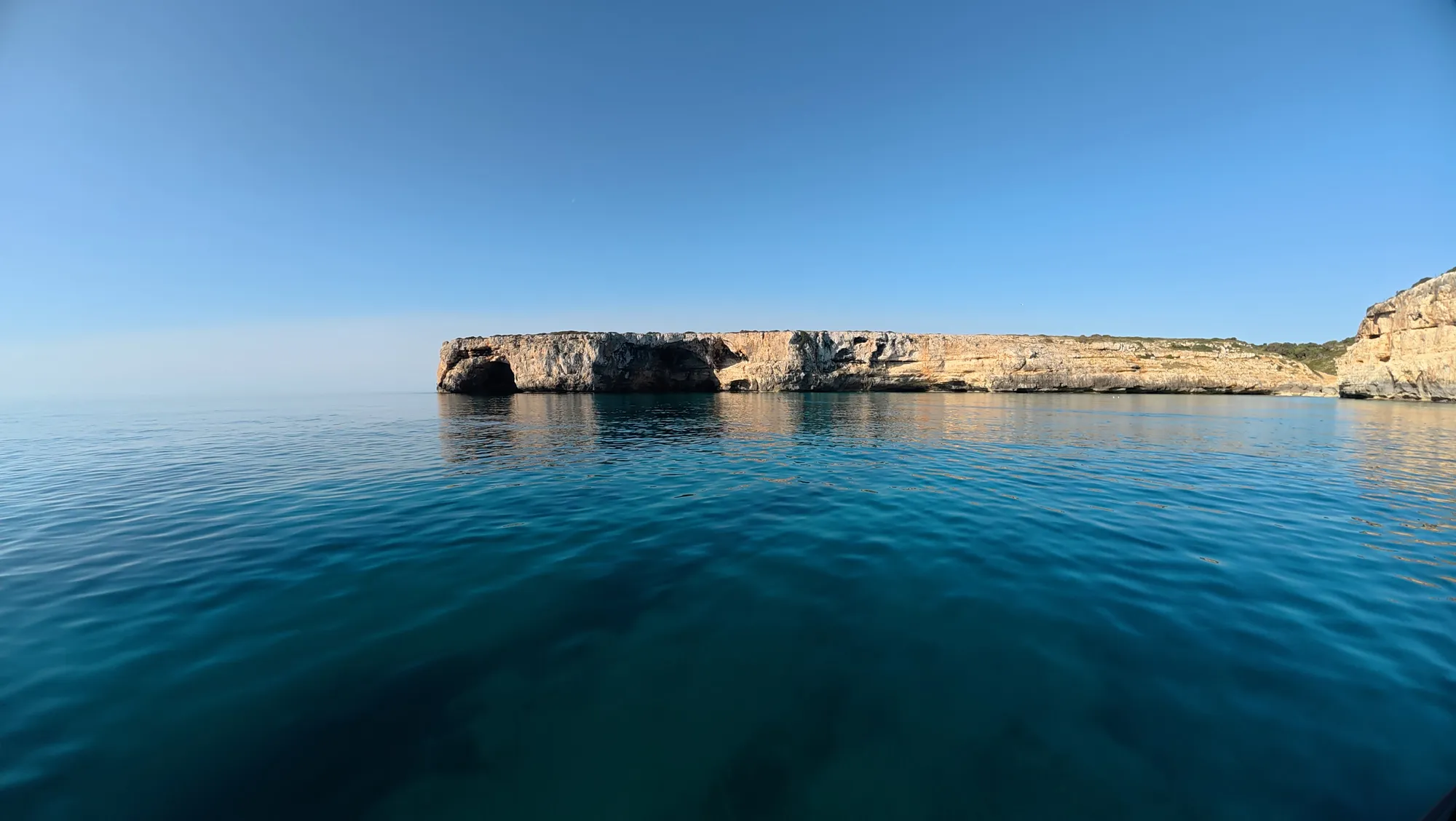 Rocky coves and clear water along the coast near Porto Cristo, Mallorca